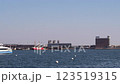 Running speed boat at Boston harbor and airplane taking off from Boston Logan International Airport 123519315