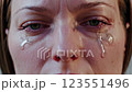 Emotional Close-Up Shot of a Womans Tearful Expression in Film Footage 123551496