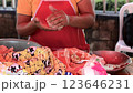 Close up of hands making homemade pupusas. Woman's hands preparing traditional pupusas dough. Concept of elaboration of Nicaraguan pupusas 123646231