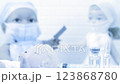 Toy doctor and doll nurse under treatment of sick little doll  123868780