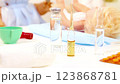 Toys medical treatment of sick little doll  123868781