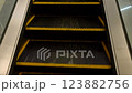 Moving up the escalator with metal sides and metal steps 123882756