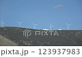 Windmills spin on the hills near Antikyra,  in Greece 123937983