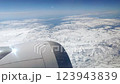 View Through Airplane Window On Snowy Mountain 123943839