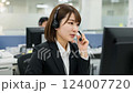 Office scene with female call center operators working, Japanese women in suits 124007720