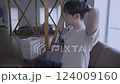 A man who dries his hair with a hair dryer 124009160