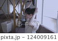 A man who dries his hair with a hair dryer 124009161