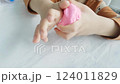 a child's hand playing with clay, slowmotion 124011829