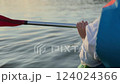 Close-up shot of woman holding a  kayak paddle  124024366