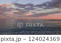 Pink sunset above blue waves of Mediterranean sea in Barcelona 124024369