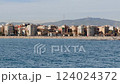 View from a boat of the Barceloneta beach and promenade with Tibidabo hill in the background 124024372
