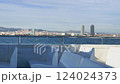 View of the beaches and city of Barcelona from the upper deck of a sightseeing boat 124024373