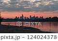 Warsaw skyline cityscape view from the side of Vistula river during pink summer sunset 124024378