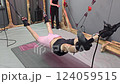 Patient undergoing physiotherapy with suspension training 124059515