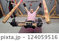 Patient doing spine traction therapy with physiotherapist assistance 124059516