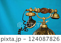 Retro telephone on a blue background 124087826