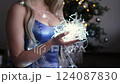 Woman holding christmas lights in slow motion 124087830