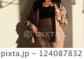 Influencer posing showing beige summer outfit 124087832