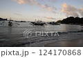 El Nido at sunset, blue sea and silhouette of fishing boats 124170868
