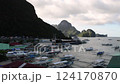 El Nido at sunset, blue sea and silhouette of fishing boats 124170870