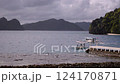 A boat sailing through the sea of El Nido and a tranquil view 124170871