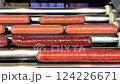 Delicious hot dogs are sizzling on a roller grill, making them the perfect choice for outdoor gatherings and events 124226671