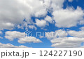 Timelapse of cumulus clouds moves in the blue sky. 124227190