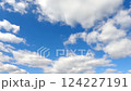 Timelapse of cumulus clouds moves in the blue sky. 124227191