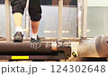 the feet of a person who runs a treadmill at a fitness club 124302648
