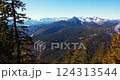 Breathtaking mountain vista showing snow-capped peaks and lush valleys in a serene natural landscape 124313544
