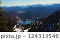 Breathtaking view of snow-capped mountains and serene lake during sunny day in the Alps 124313546