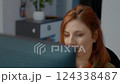 Woman takes a break from work at home office while relaxing and meditating 124338487