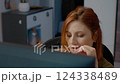 Worried woman reading on computer worried about bad news at home 124338489