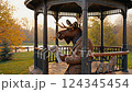 anthropomorphic moose reading a newspaper in a park 124345454