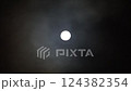 On a full moon night, hidden by drifting clouds 124382354
