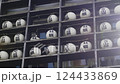 The exterior wall of the shop is lined with lanterns bearing the Japanese words "Oysters" and "All you can eat." 124433869