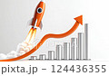 A rocket with flames, launching upwards alongside an ascending graph, representing growth and success. 124436355