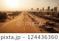 A desolate desert with sand dunes encroaching upon the ruins of a city, conveying a sense of abandonment and environmental change. 124436360