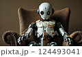 Vintage robot enjoying a relaxing moment in an armchair 124493041
