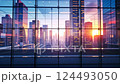 Reflective urban sunset over modern skyscrapers with glass facades 124493050