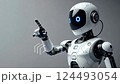 Futuristic robot pointing gesture with blue accents in studio lighting 124493054
