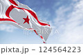 National flag of Northern Cyprus waving in the wind on a clear day. Seamless 3d render animation. Slow motion loop. Selective focus. 124564223