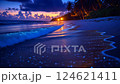 Blue hour tropical beach with glowing sunset reflections 124621411