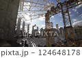 The Urban Construction Project Features Cranes Working Under Bright Sunlight 124648178