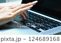 Woman hitting a laptop keyboard 124689168