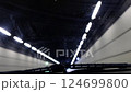 The car is driving through an underground tunnel. 124699800