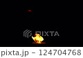 Flames are burning in a bowl isolated on a black background. Concept of particles, sparkles, flame and light 124704768