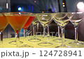 Cocktail bar with glasses and shot drinks at a party hall with festive lighting set of video footages 124728941