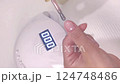 Apply gel to your thumb 124748486