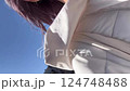 A woman walking on a very windy day 124748488